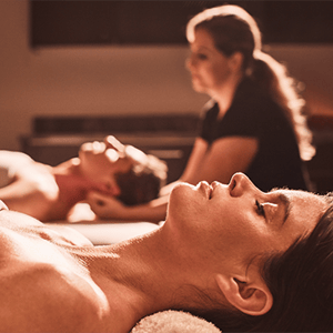 Man and woman receiving a Valentine's Day couples massage at Viva Day Spa in Austin, TX.