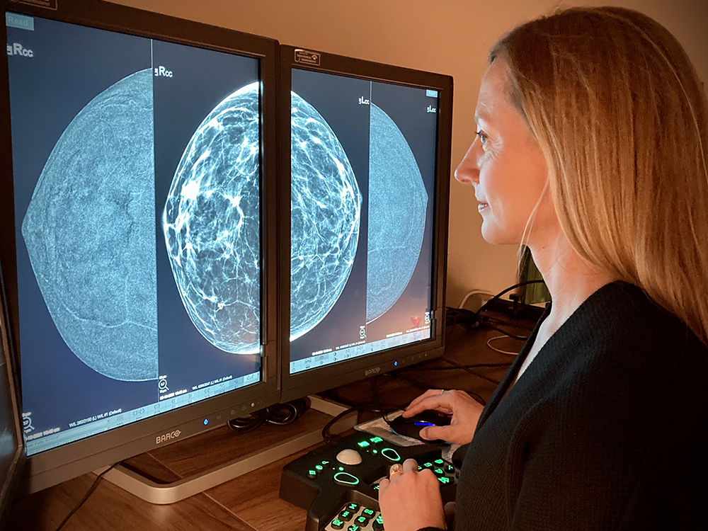 Dr. Jeri Sue Plaxco, breast radiologist at Austin Breast Imaging reading a mammogram.