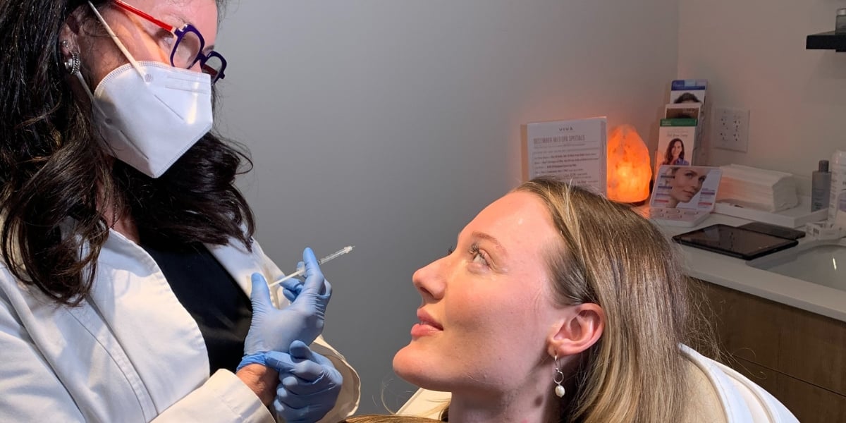 A Viva Day Spa + Med Spa aesthetic injector administering a Botox treatment to a woman at one of our med spa locations in Austin, Dallas, and Round Rock, TX