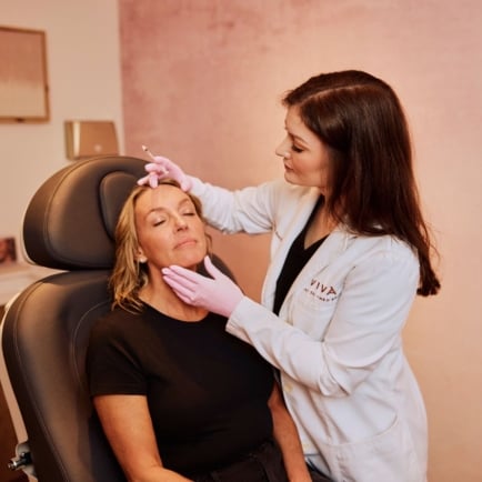 Meagan Whitney, PA-C, Aesthetic Physician Assistant & Injection Specialist performing a lip filler injection treatment on a patient at Viva Day Spa + Med Spa in Austin, Dallas, and Round Rock, Texas.