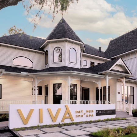 Exterior of Viva Day Spa + Med Spa in a charming Victorian-style building in Round Rock, TX