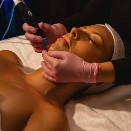 A woman receiving a Hydrafacial at Viva Day Spa + Med Spa