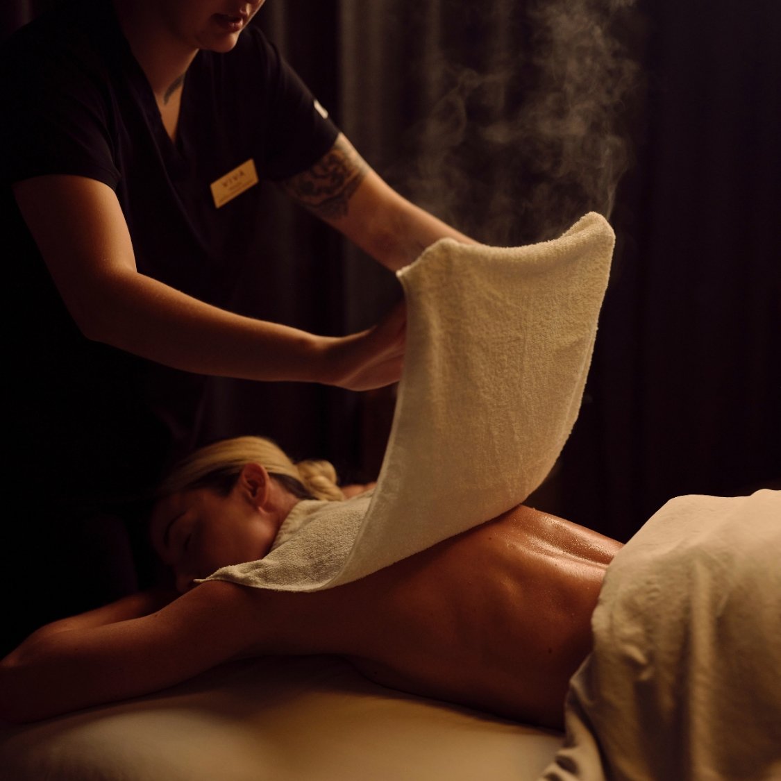 Woman on a spa table receiving a massage at Viva Day Spa + Med Spa